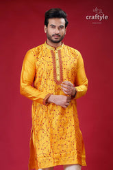 a man in a yellow indian outfit