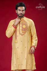 a man in a yellow outfit posing for a picture