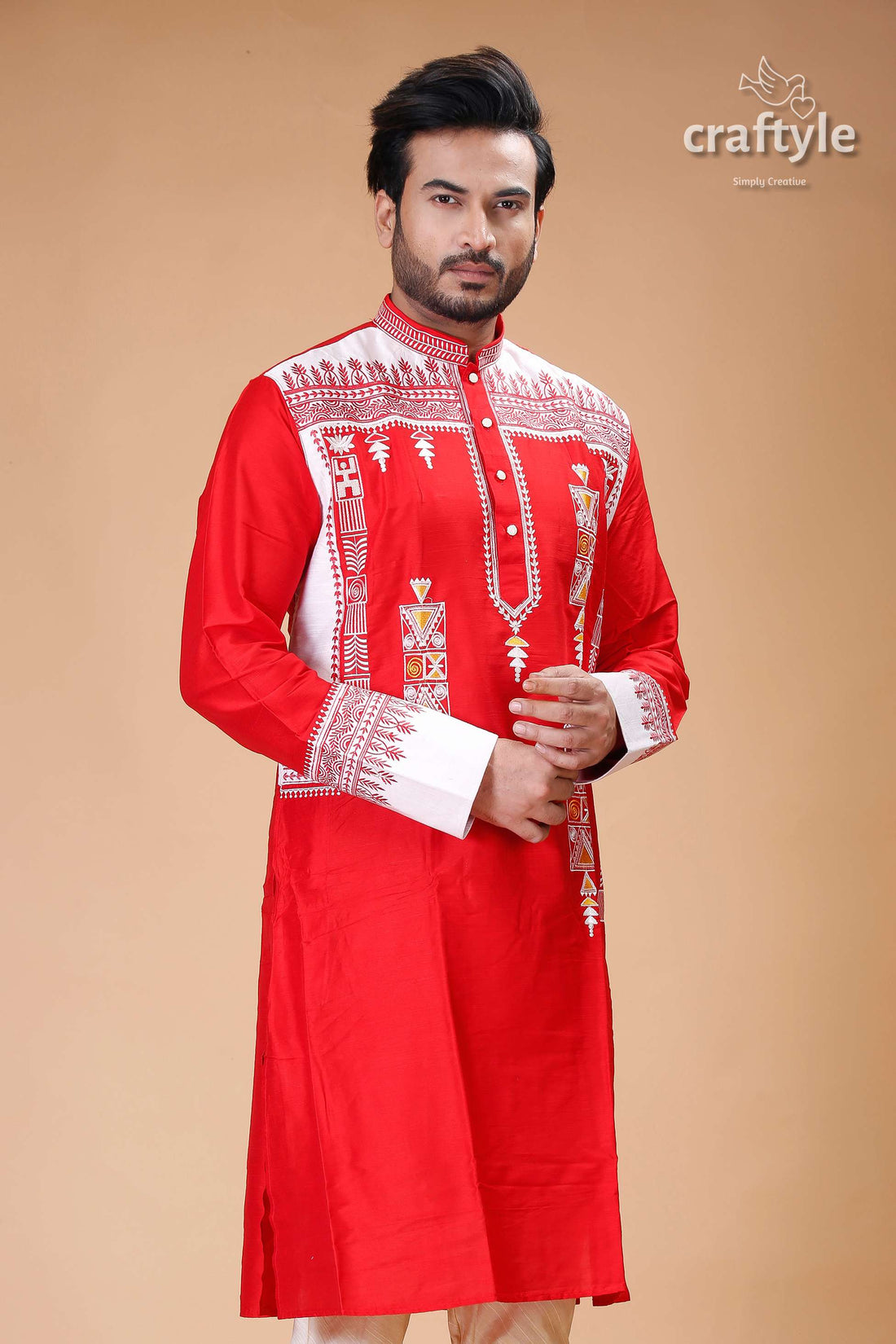 a man in a red and white indian outfit