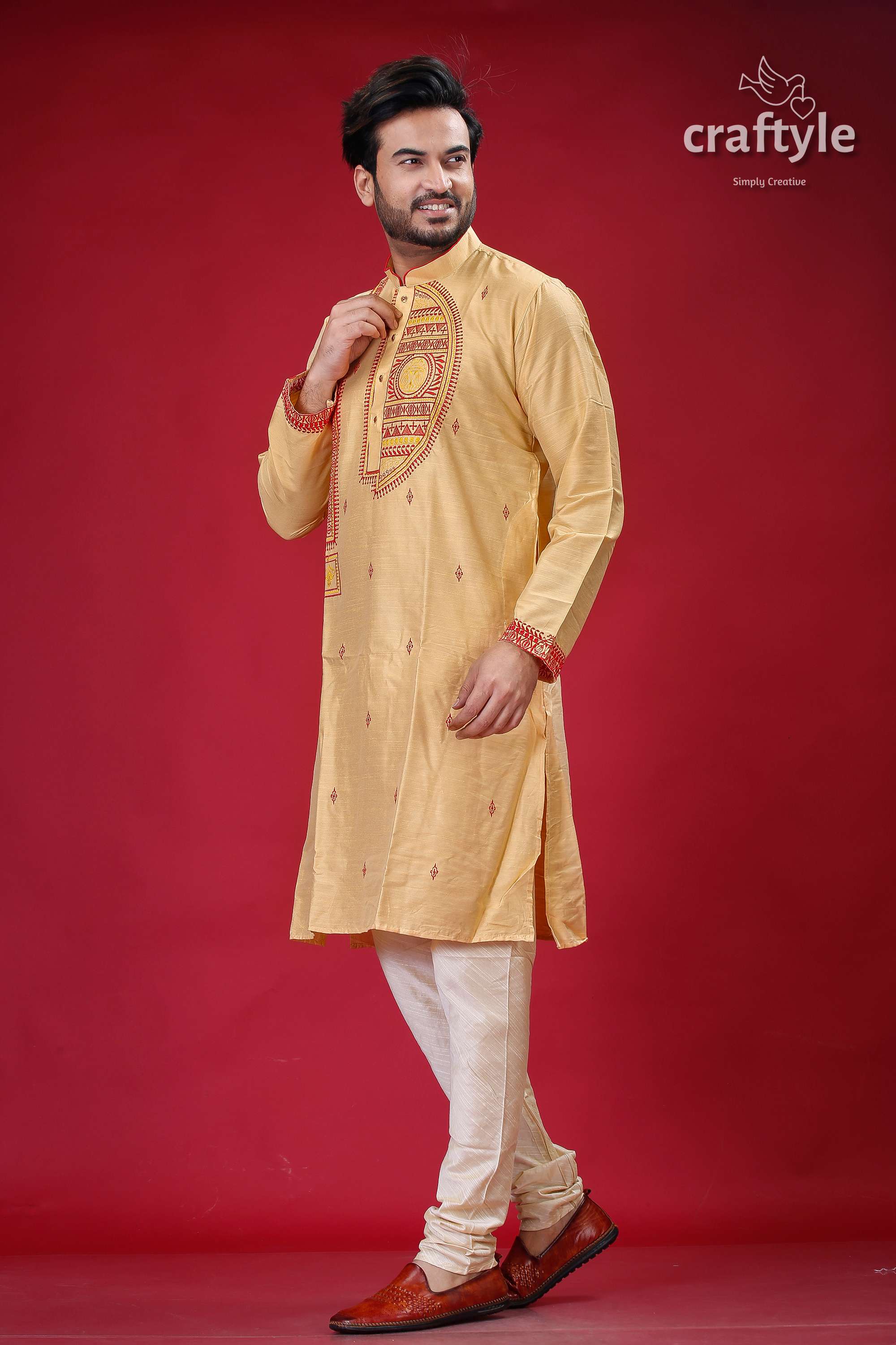 a man in a yellow outfit poses for a picture