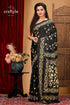 a woman in a black and gold sari