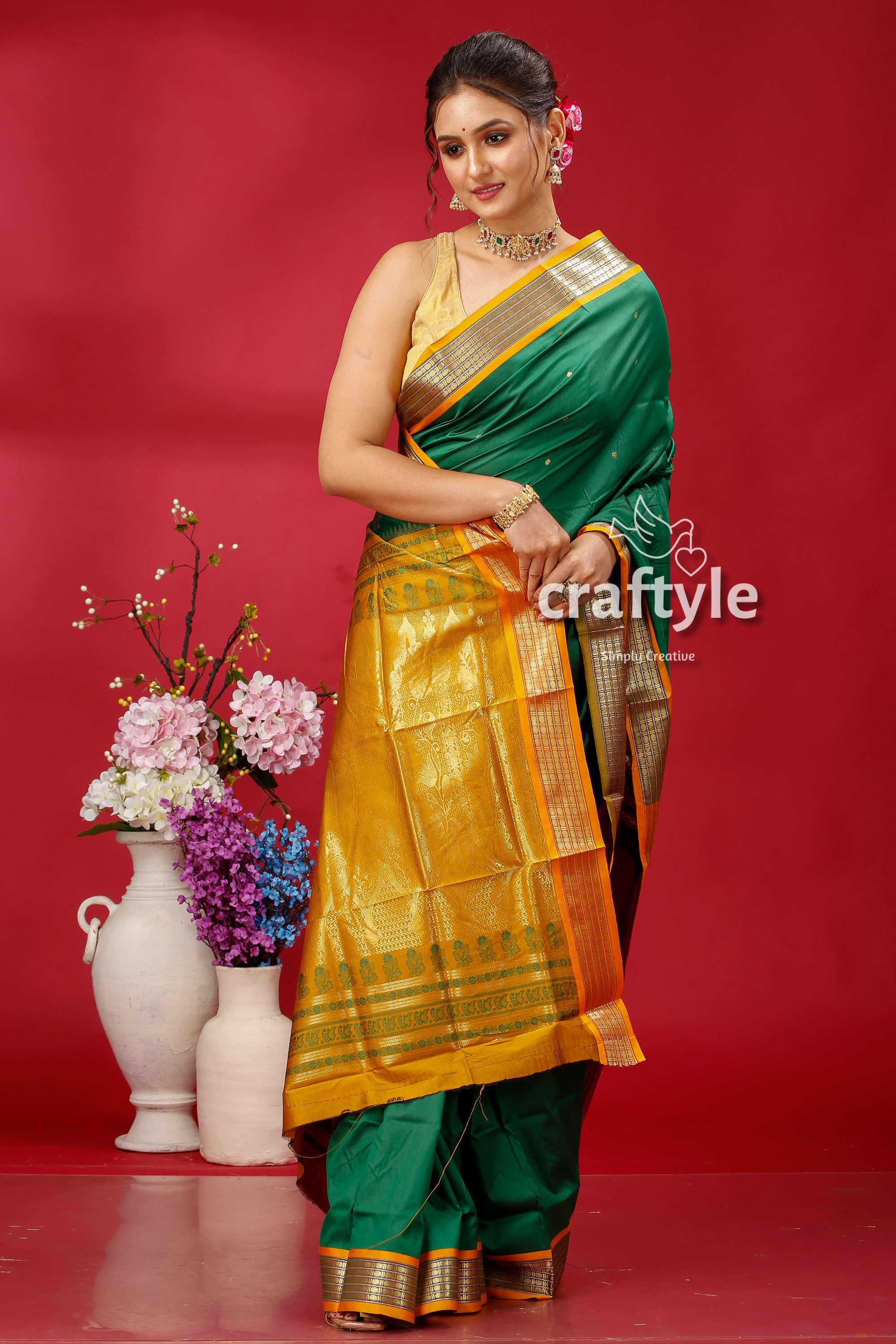 a woman in a green and yellow sari