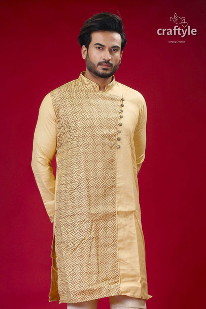 a man in a yellow outfit standing in front of a red background