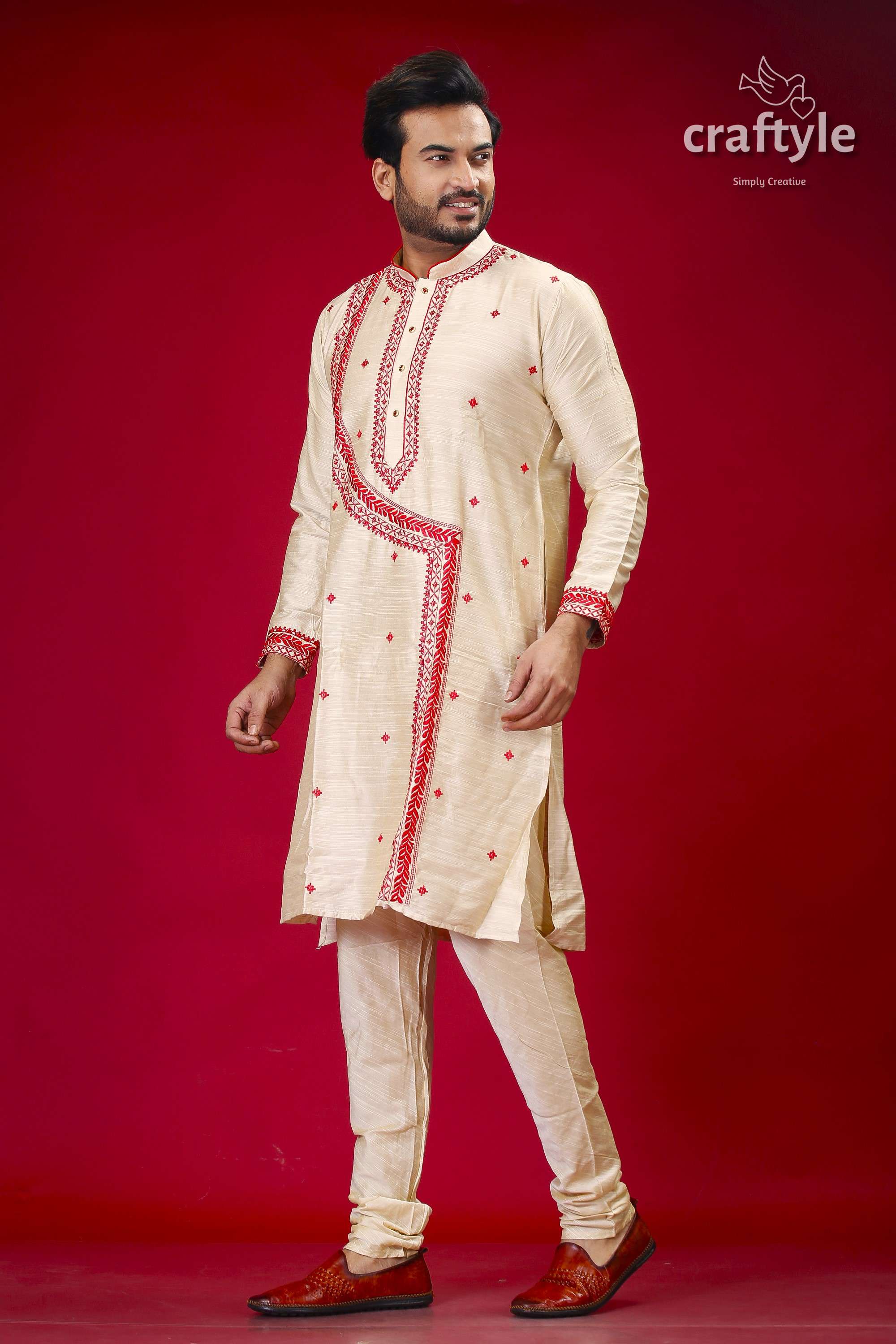 a man in a white and red indian outfit