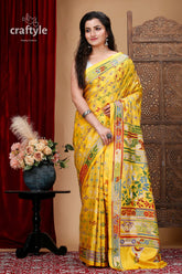 a woman in a yellow sari posing for a picture