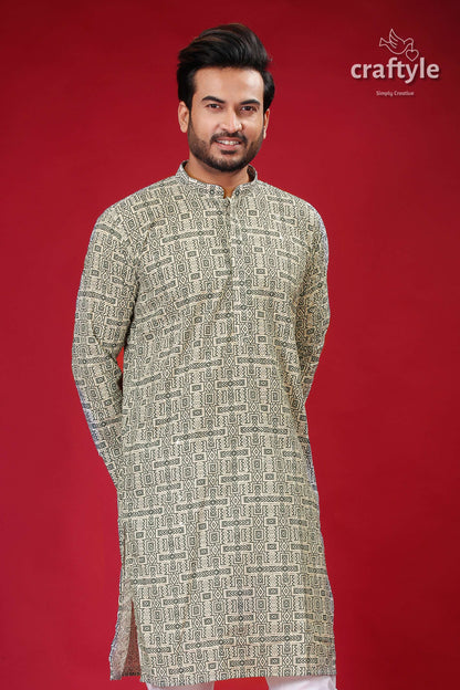 a man standing in front of a red background