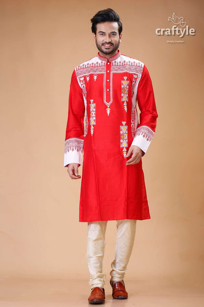 a man in a red and white indian outfit