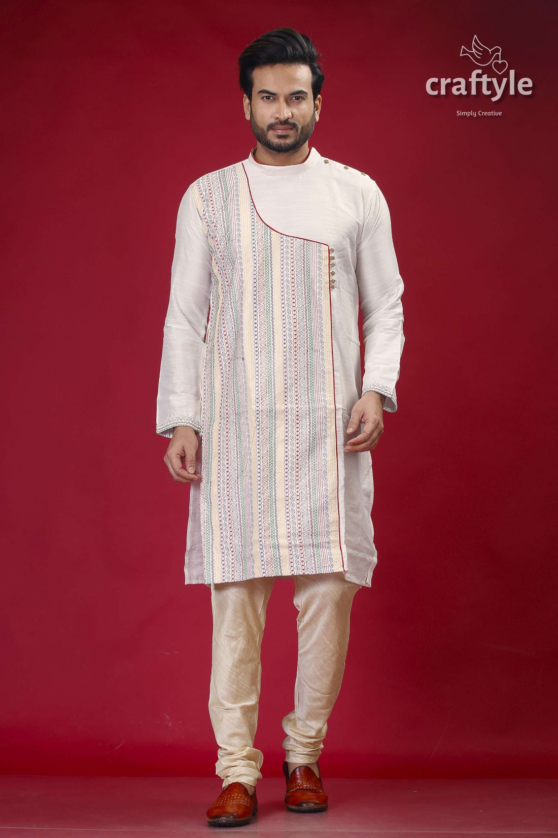 a man standing in front of a red background