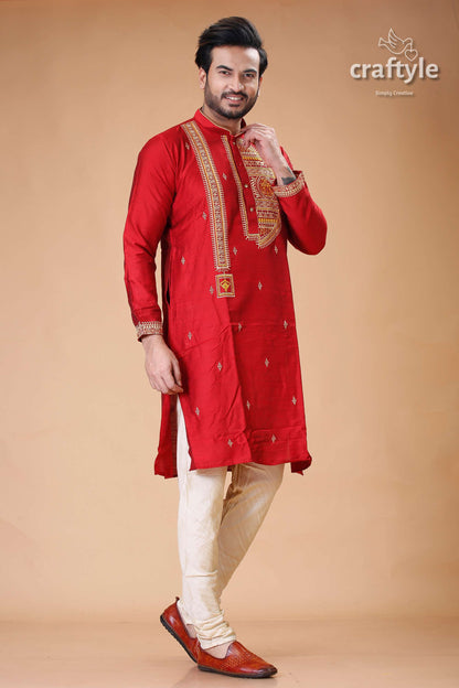 a man in a red and white indian outfit