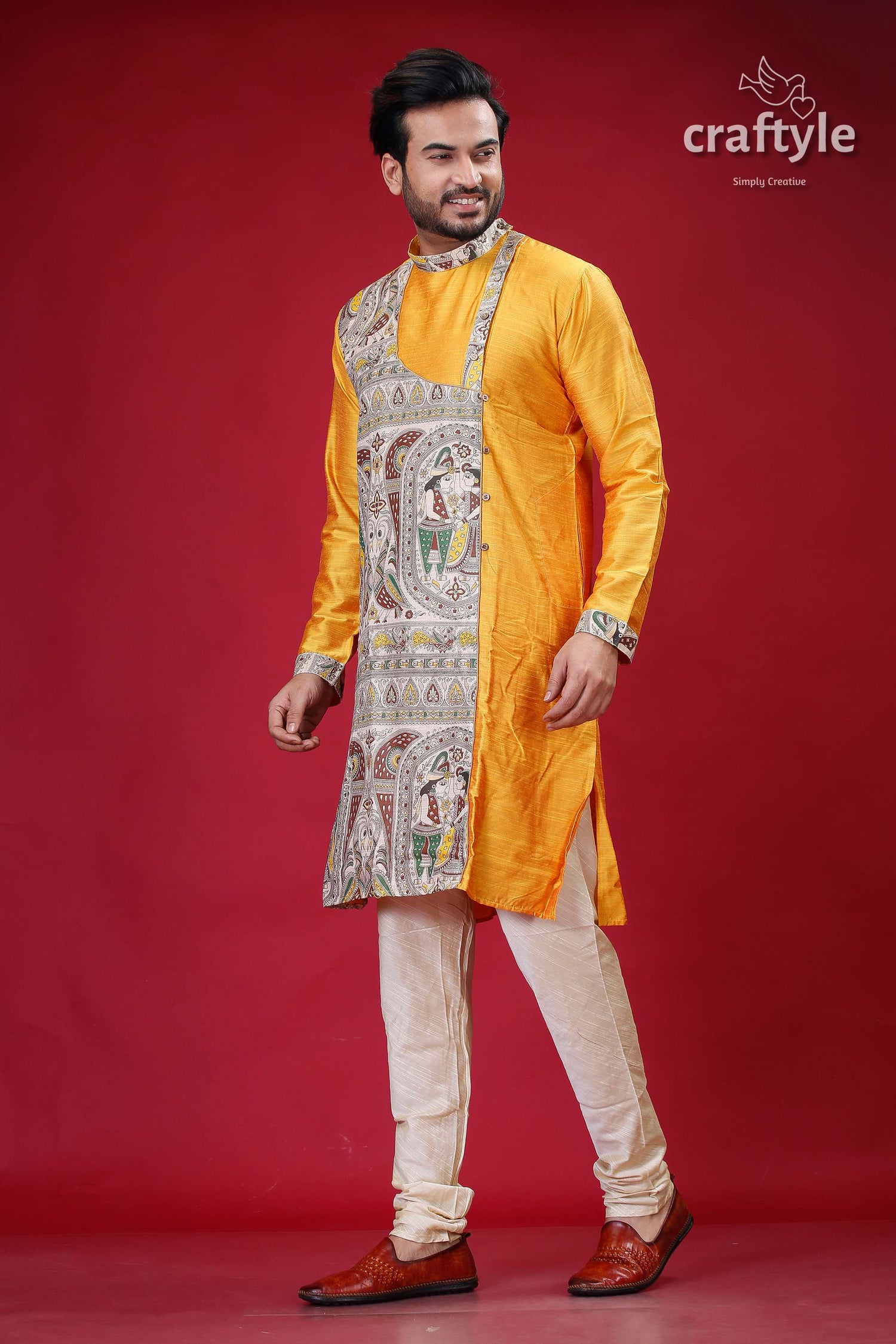 a man in a yellow sherwa with white pants