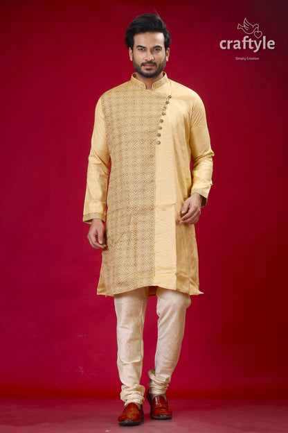 a man in a yellow outfit standing in front of a red background