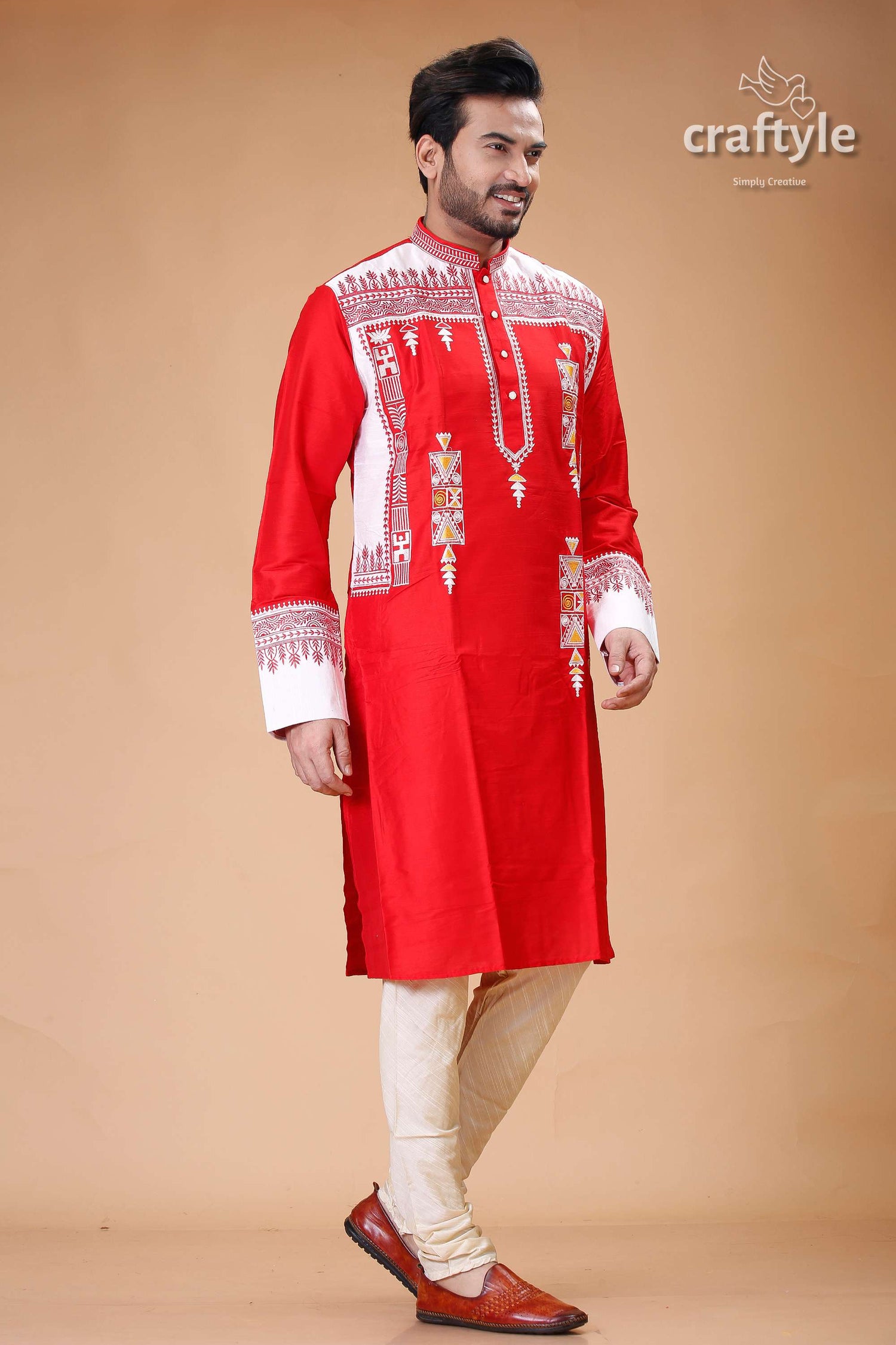 a man in a red and white indian outfit