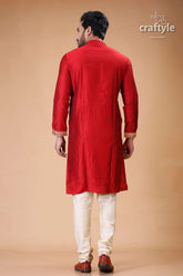 a man in a red indian outfit