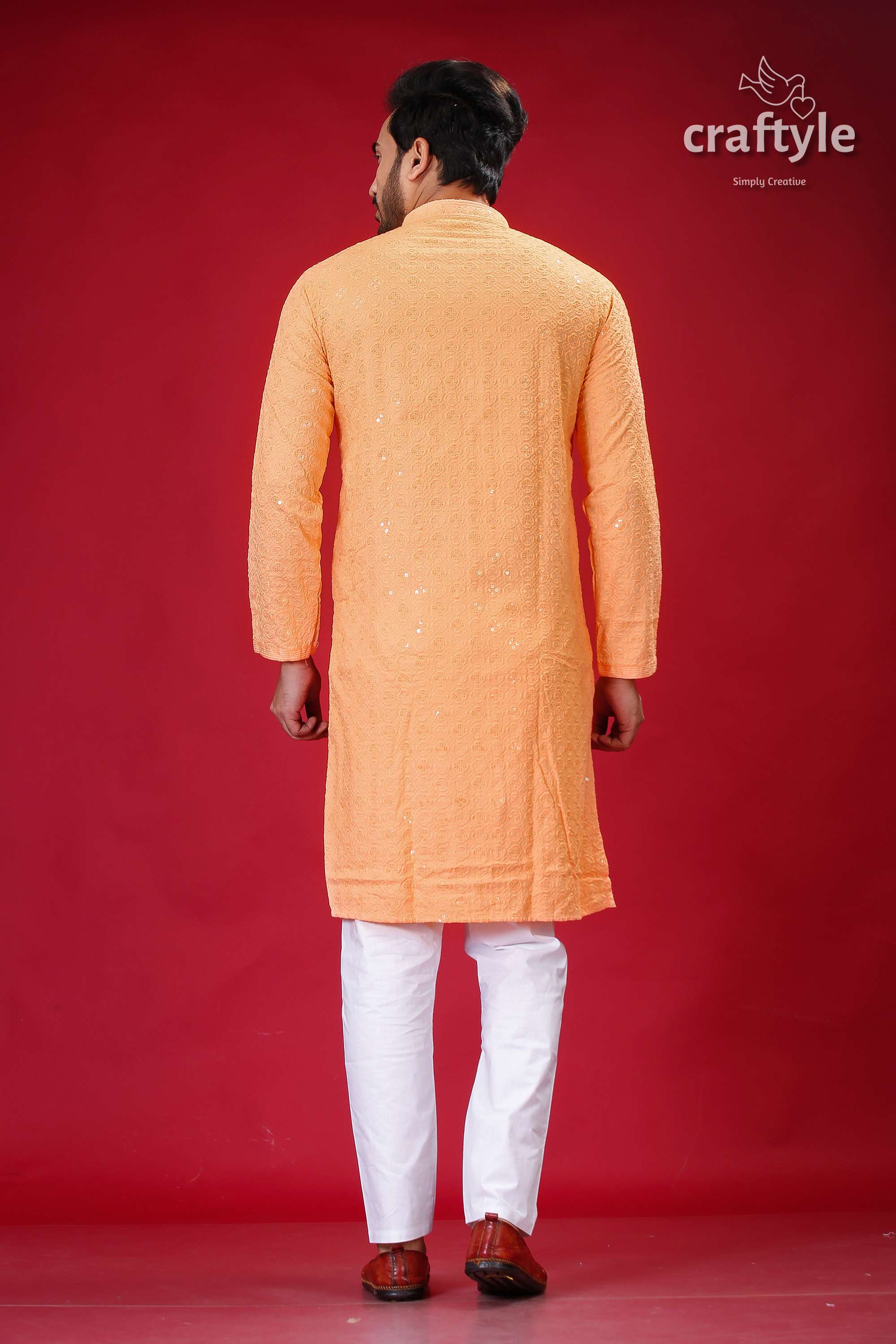 a man in an orange and white outfit