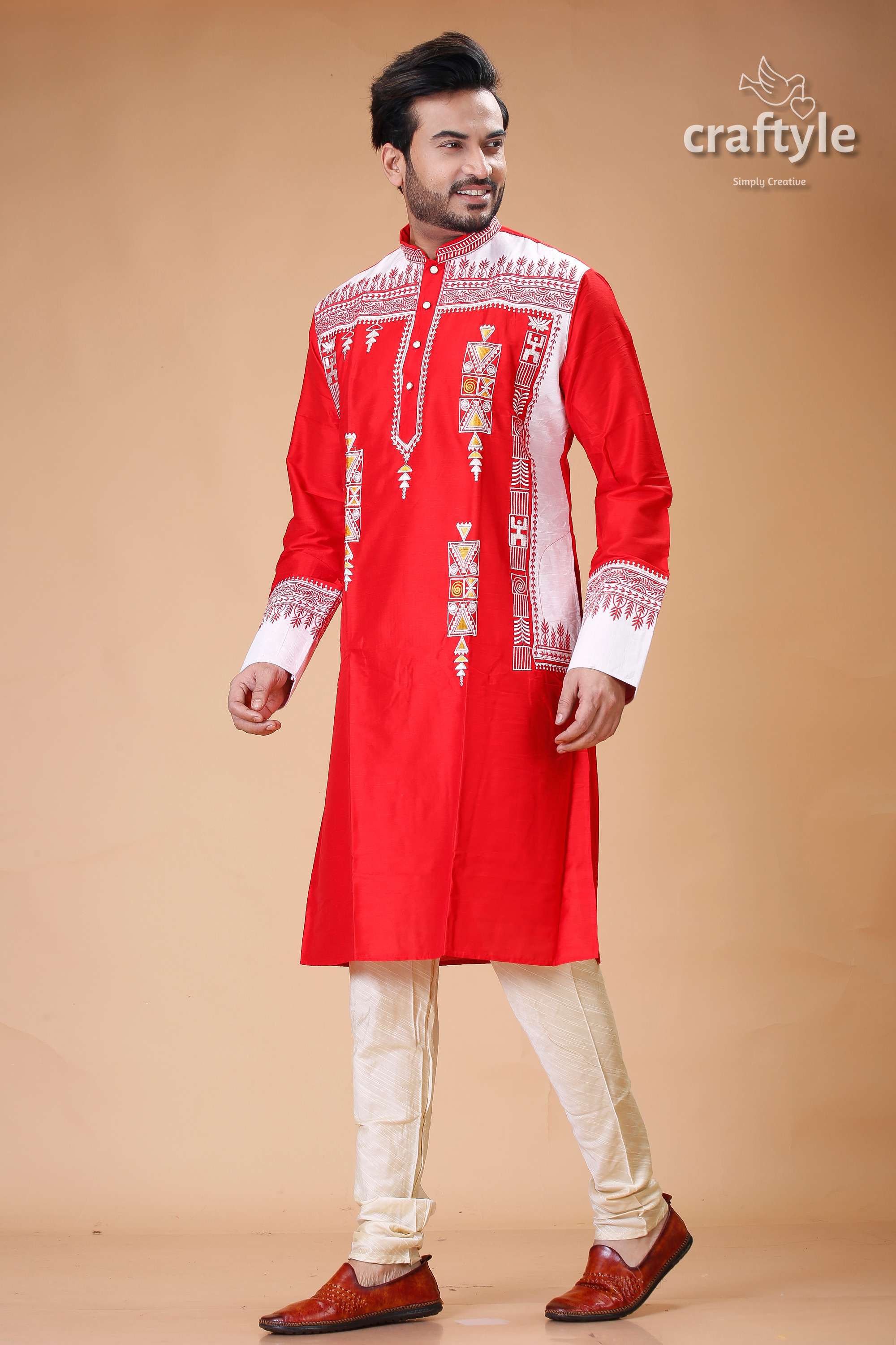 a man in a red and white indian outfit