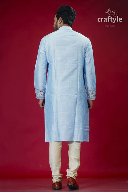 a man in a blue and white indian outfit