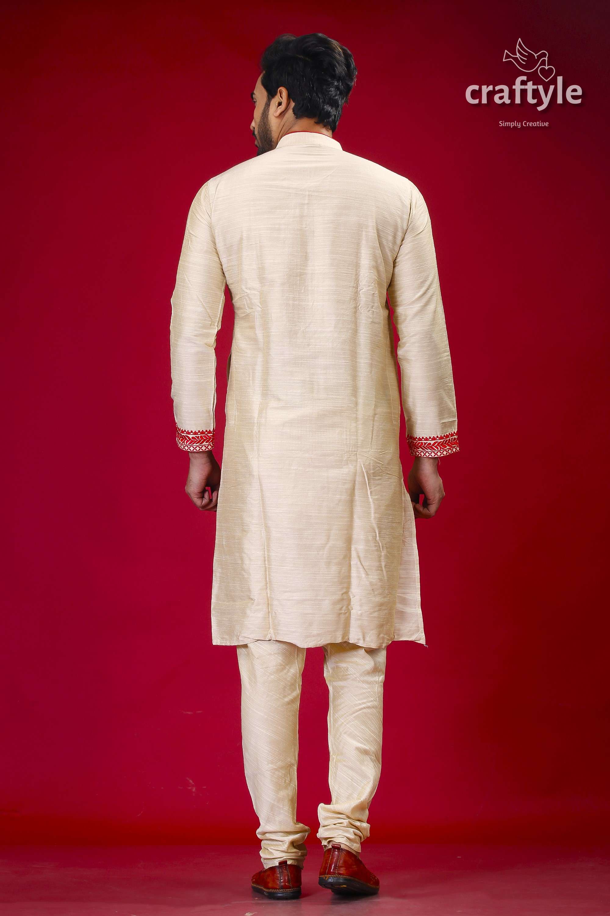 a man in a white sherwa with a red background