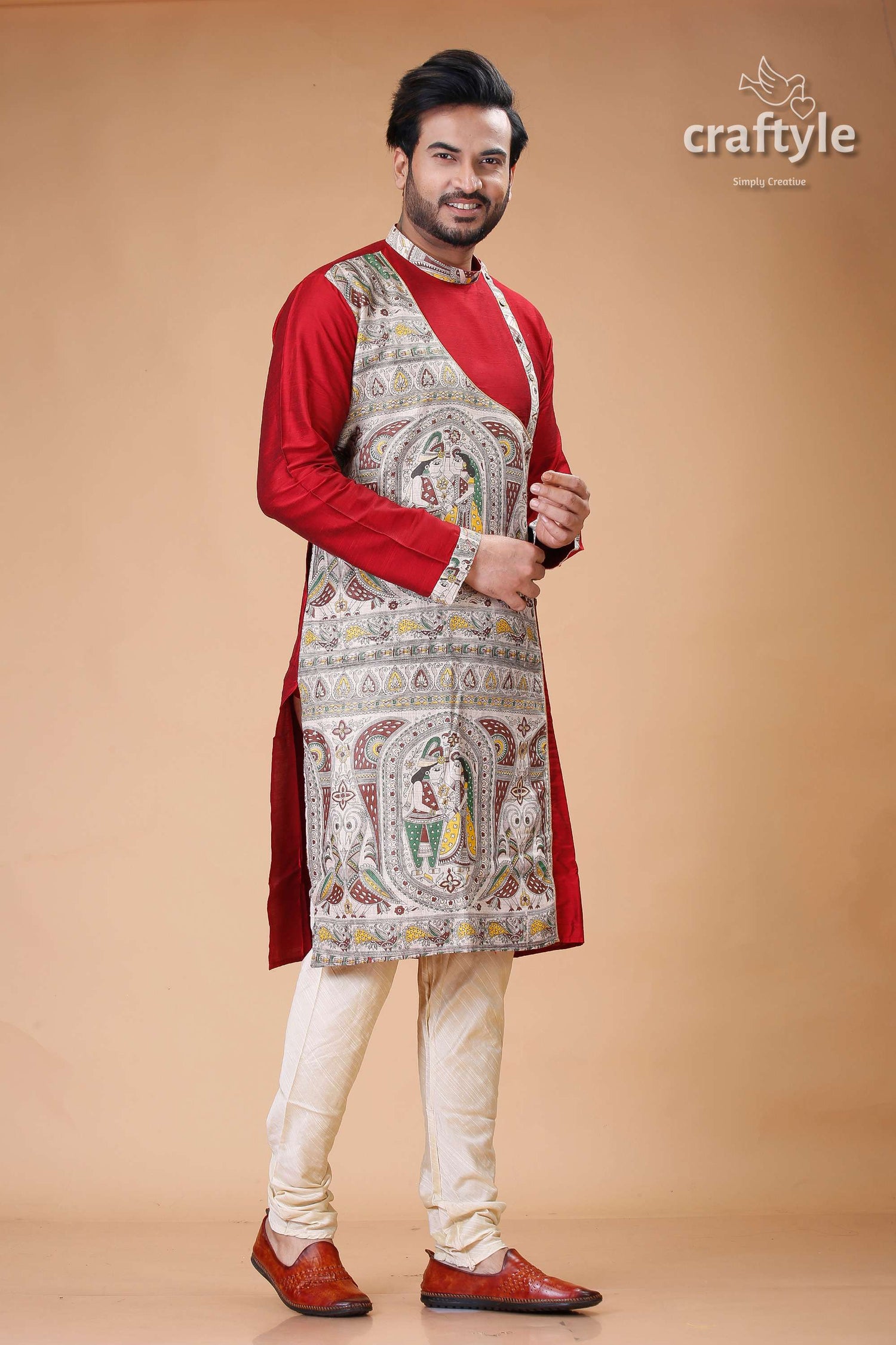 a man in a red and white indian outfit