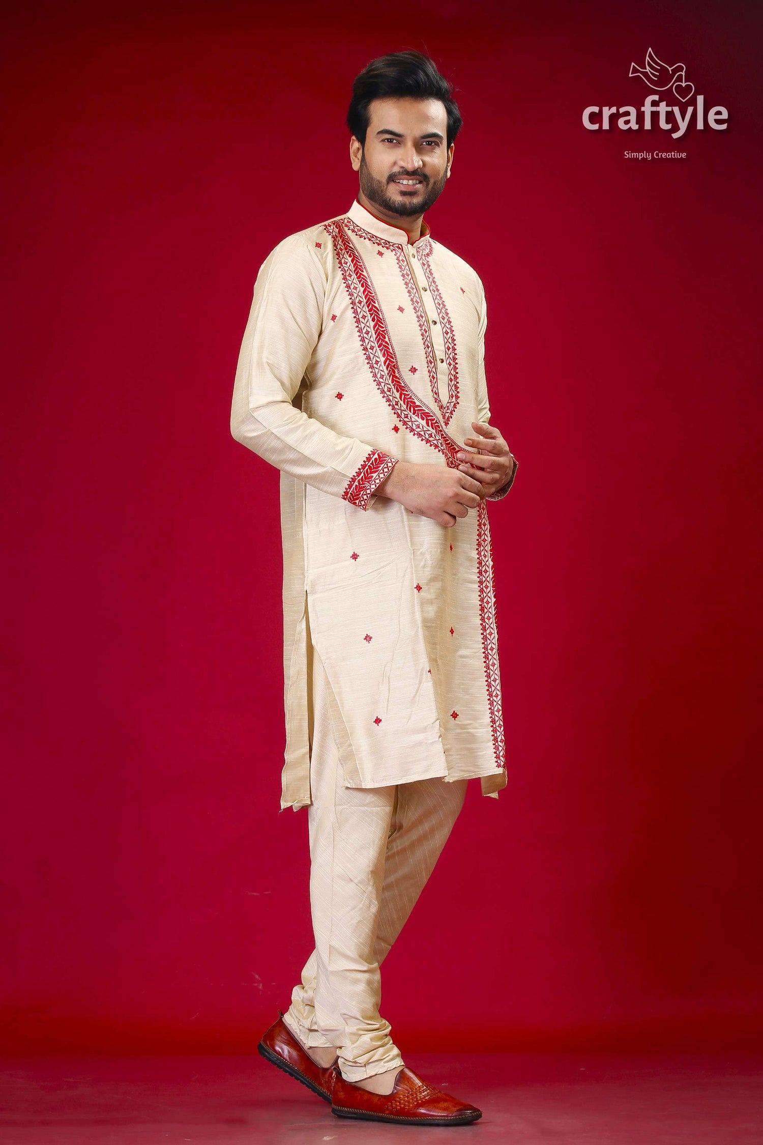 a man in a white and red indian outfit