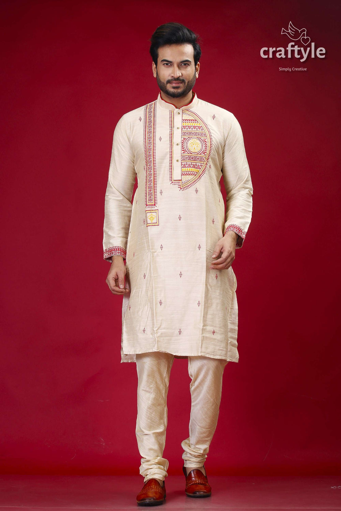 a man in a white outfit standing in front of a red background