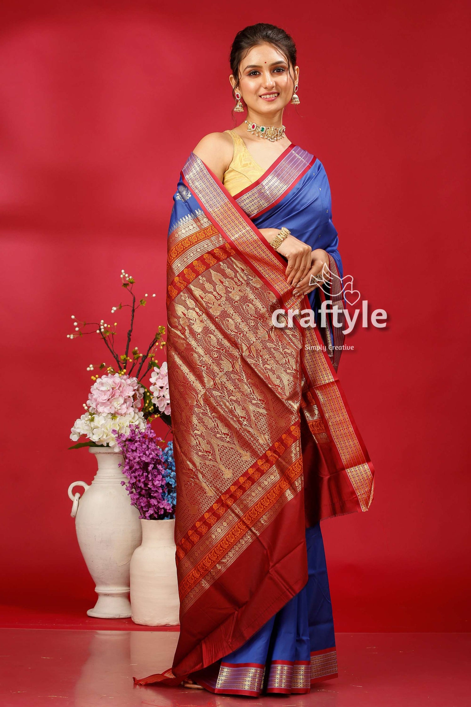 a woman in a blue and red sari