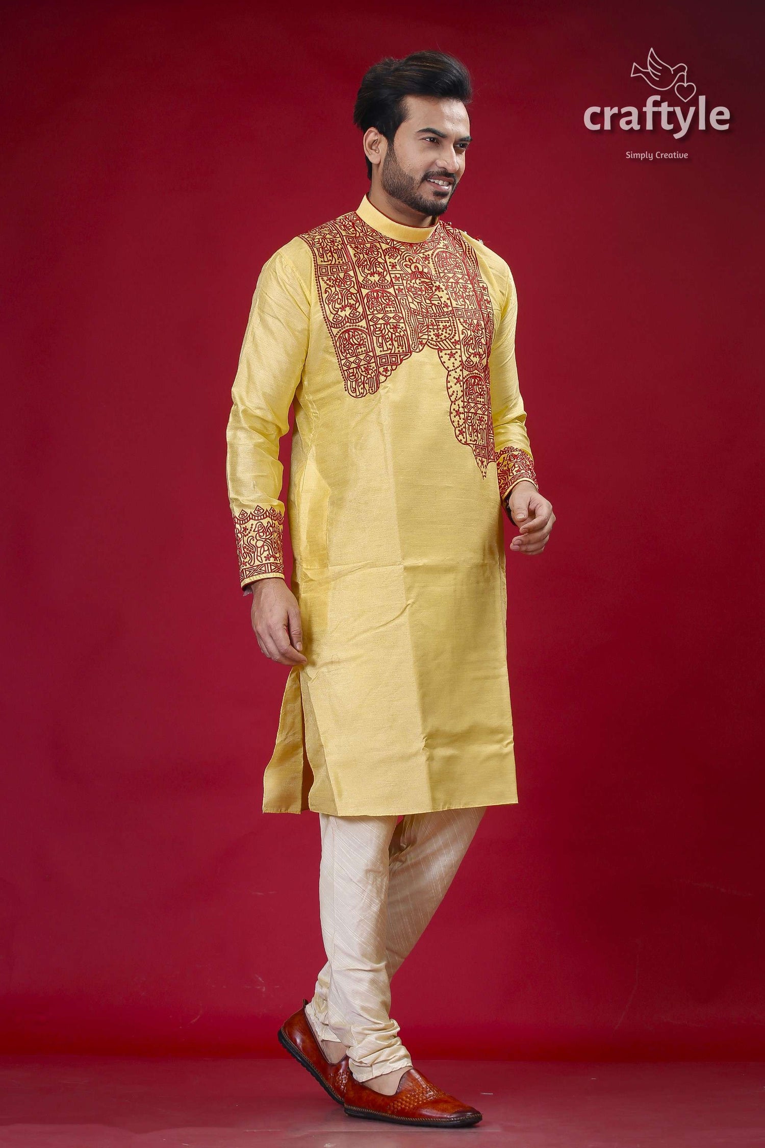 a man in a yellow outfit standing on a red background