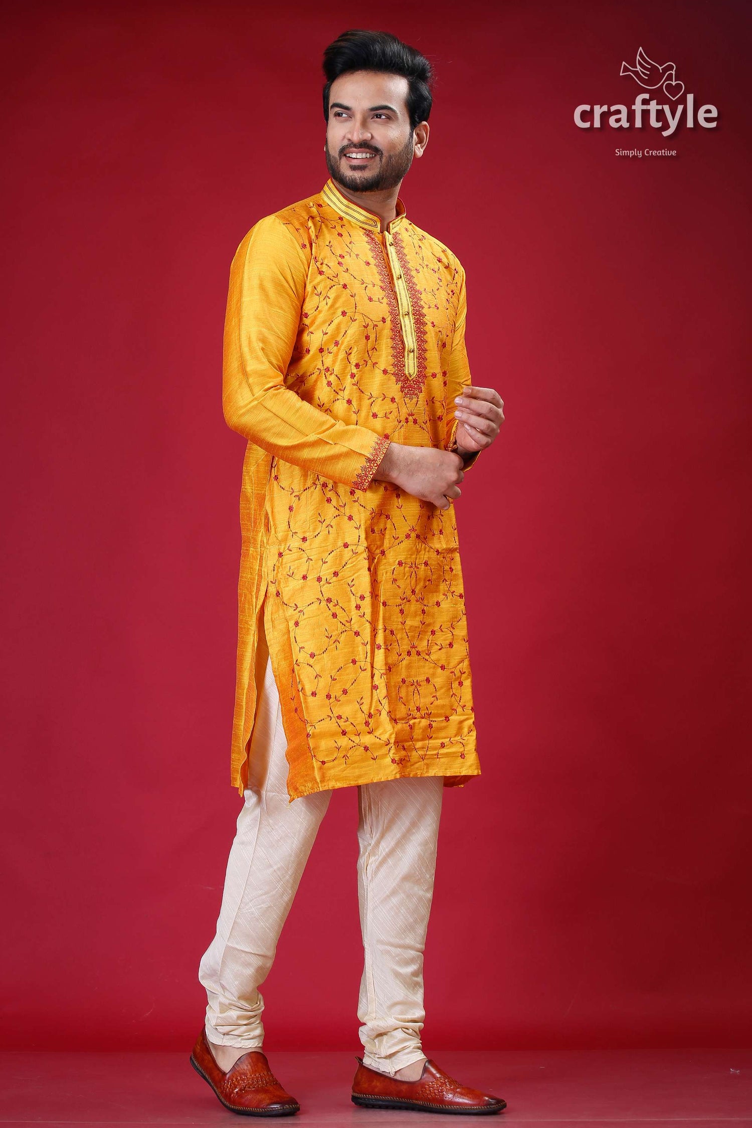 a man in a yellow outfit posing for a picture