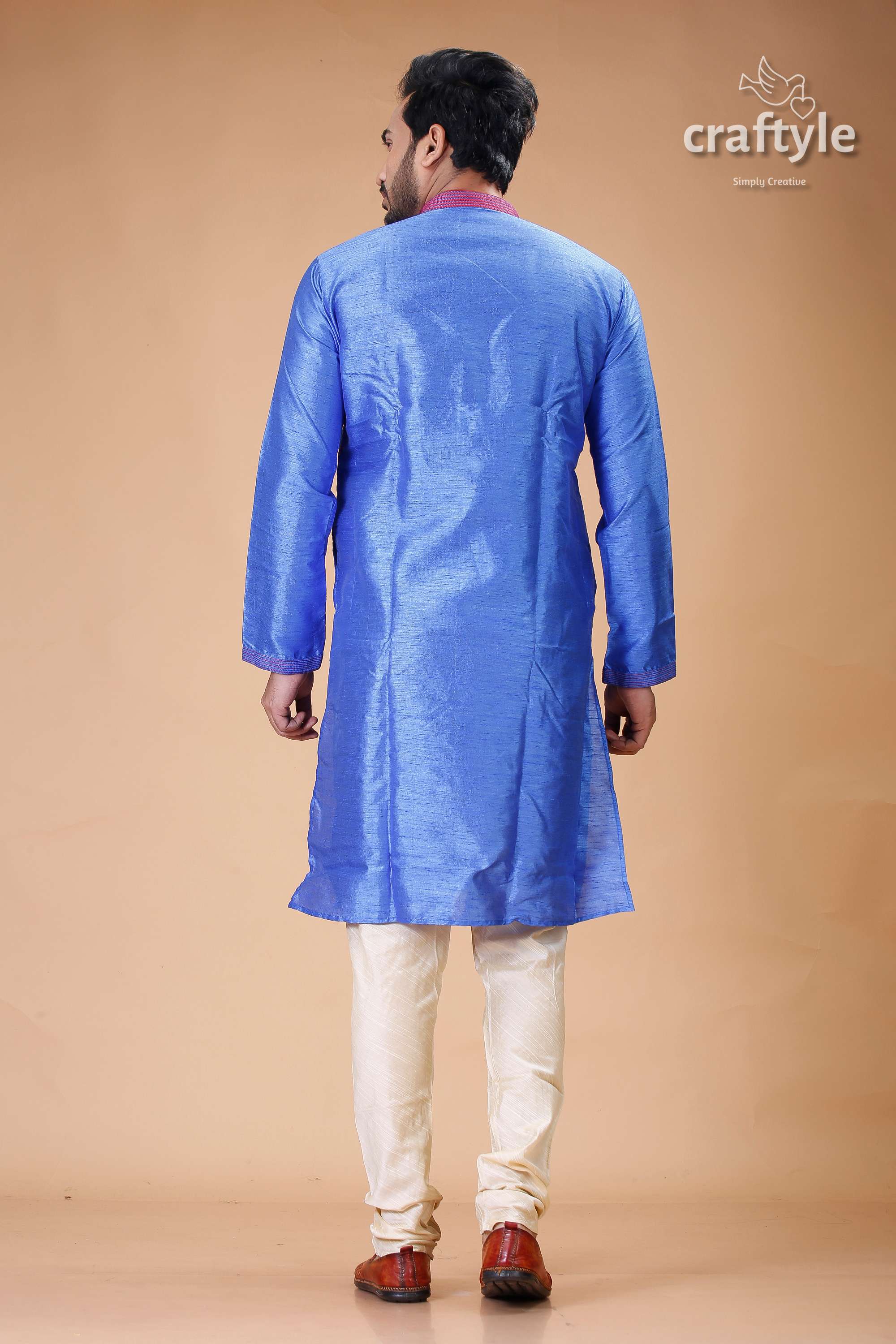 a man in a blue indian outfit