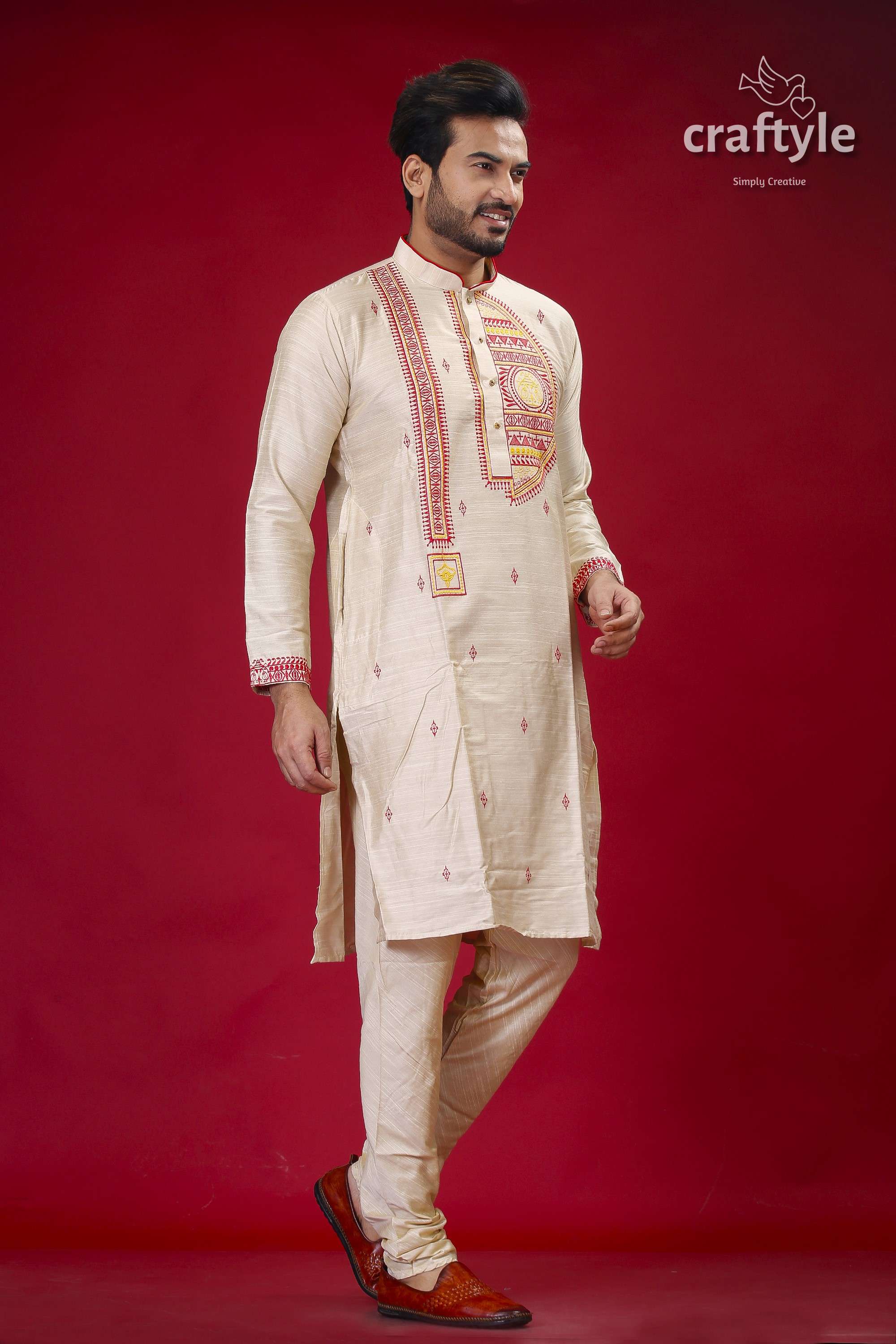 a man in a white outfit standing on a red background